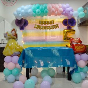 Pastel-colored balloon arch decor