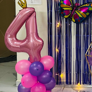 Gemini said Pink and Purple Birthday Decoration with Blue Fringe Curtain, Balloon Garland, and Butterfly Foils.