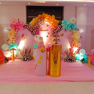 Pink and Orange Butterfly Birthday Decoration Kit with Floral Arch and Golden Plinths.