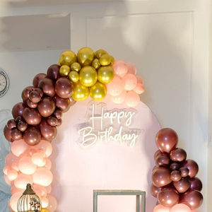 Rose Gold and Peach Balloon Arch with Gold Pedestals