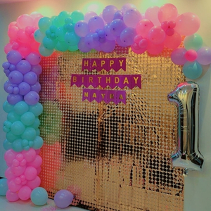 Shimmering Pastel Balloon Arch and Sequin Backdrop