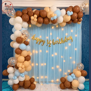 Whimsical “Happy 1/2 Birthday” Shimmer Backdrop with Chocolate & Pastel Blue Organic Balloon Arch