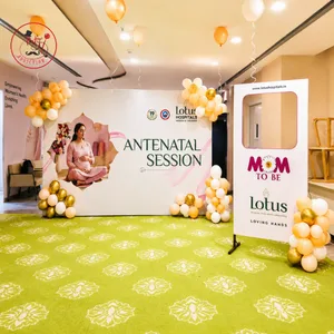 Antenatal event decoration with customized printed backdrop, balloon clusters, ceiling balloons and Mom-to-Be photo booth frame