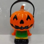 Halloween pumpkin character toy with handle and colorful spooky design