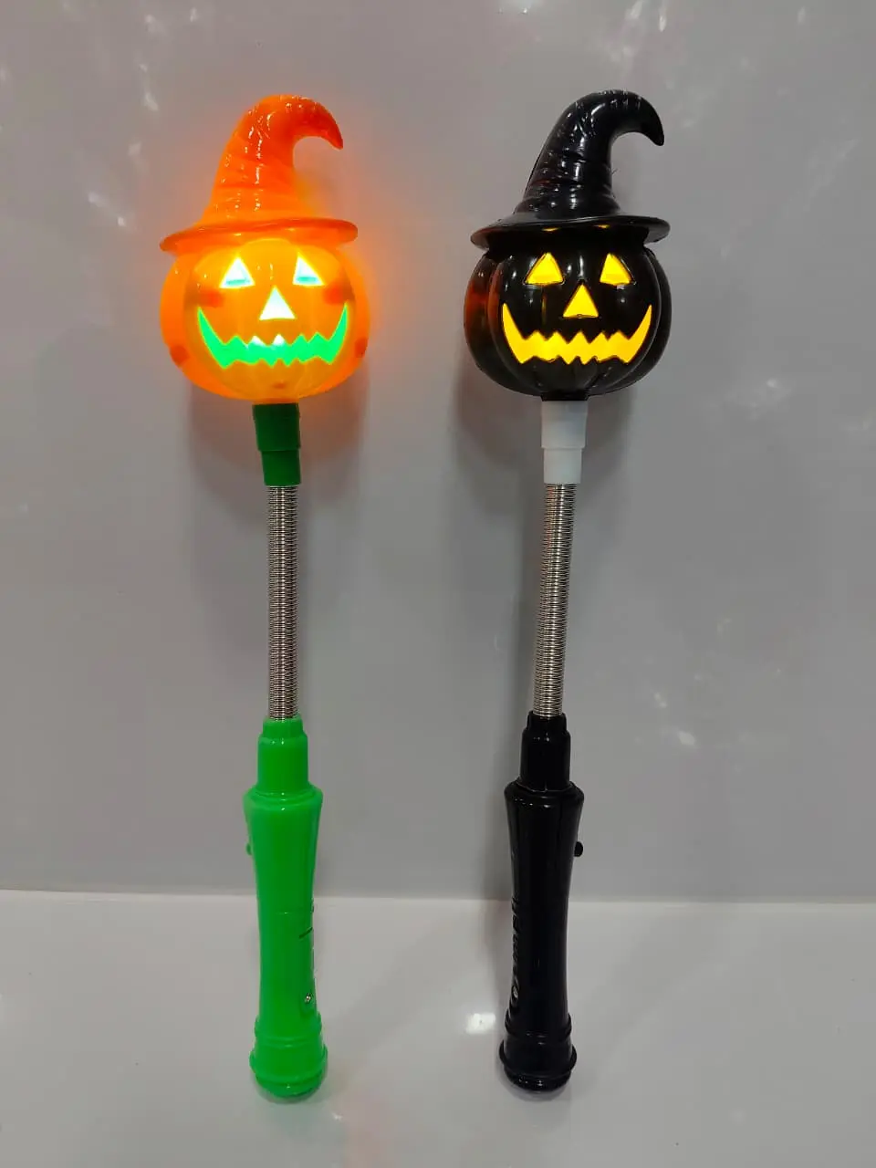 Light-up Halloween pumpkin witch wand with spooky jack-o-lantern design