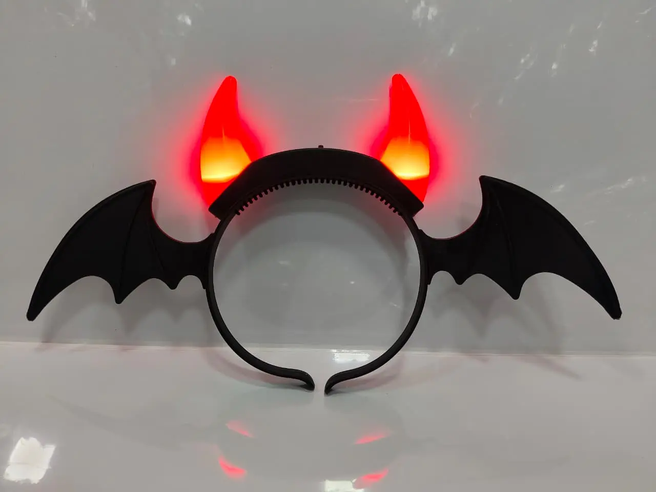 Light-up Halloween devil horn headband with black bat wings
